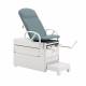 Image shown Blue Fog Upholstered Top Versa Exam Table in Pelvic Tilt Position. PLEASE NOTE: Patient Assist Handles and Drawer Warmer Switch are NOT included with this model.